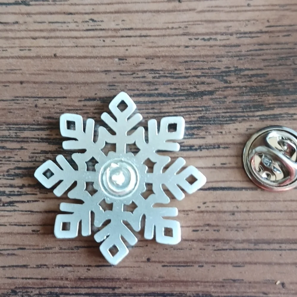 Snowflake pin, aluminum look, rhinestone center, approx 1